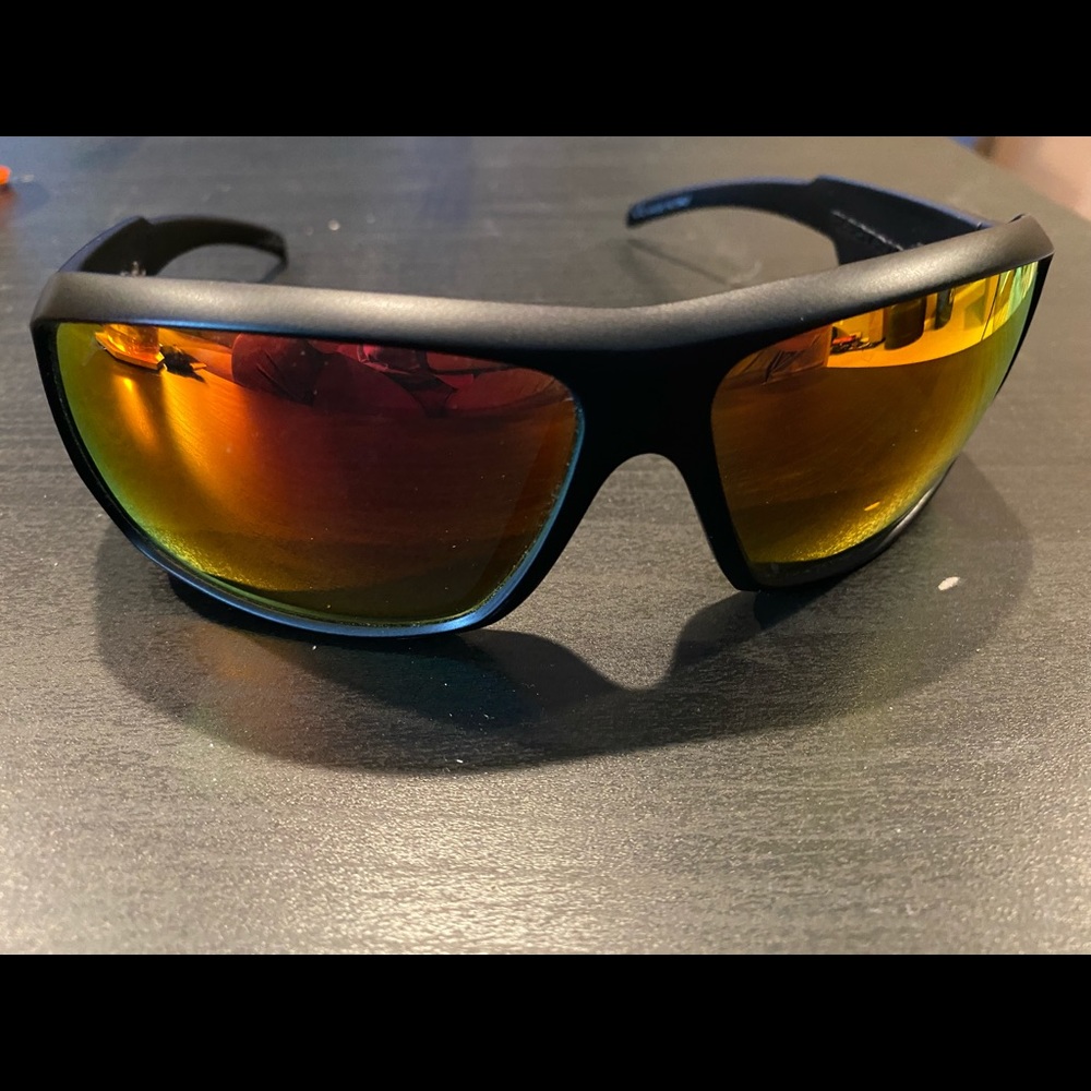 Gently used black sunglasses with orange frames!